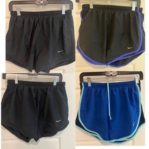 SOLD - Nike bundle - 4 pair of Women’s “Dri-Fit” Running Shorts - Size Medium